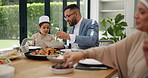 Muslim, family and child with father or food at dining table for eid, islamic celebration and hosting. Ramadan, culture and people eating at religious gathering with dinner, discussion or happiness