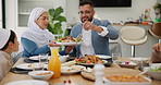 Muslim, parents and children with food or dinner at dining table for eid, islamic celebration and hosting. Ramadan, culture and people eating at religious gathering with lunch, discussion and feast