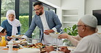 Muslim, family and children with food or dinner at dining table for eid, islamic celebration and hosting. Ramadan, culture and people eating at religious gathering with lunch, discussion or happiness