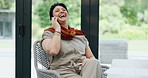 Mature woman, phone call and communication at home, relaxing and laughing for humor in conversation. Female person, speaking and internet connection for gossip, comedy and funny joke on technology