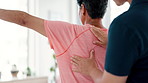 Woman, therapist and stretching arm for healthcare, appointment or physiotherapy at hospital. Closeup of nurse or chiropractor checking patient shoulder muscle for examination or clinic consultation