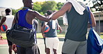 Basketball, men and friends with fist bump on a court for a game and workout outdoor with fun. Greeting, playing and teamwork for match with athletes for sport with a ball for competitive players