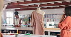 Fashion designer, mannequin and woman thinking of clothes, idea and planning in startup business. Tailor, inspiration and person with dress on dummy, creative or seamstress with vision in workshop