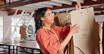 Woman, fashion designer and checking template for measurement or apparel size on rail at workshop. Female person, tailor or seamstress writing, planning or textile for clothing production at boutique