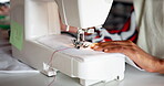 Hands, sewing machine and fabric in studio for fashion manufacturing, small business or production. Person, fingers and equipment in workshop for clothing tailor or ecommerce, pattern or creativity
