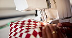 Sewing, hands and fashion designer on machine closeup with fabric for manufacturing in startup business. Seamstress, tailor and fingers on equipment for production, creativity or threading in studio