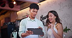 Teaching, cafe and employees with a tablet, smile and barista with teamwork or cooperation. Coffee shop, together at a small business or startup with entrepreneur or waitress with digital touchscreen