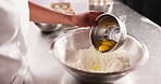 Hands, eggs and baking on table with flour in home, baker and process of dough bowl on kitchen counter. Chef, working and wet to dry ingredients for wheat bread, baking and culinary cooking in hotel
