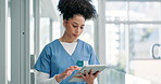Woman, nurse and tablet for planning or research in hospital, information and report on technology. Female person, doctor and networking or checking results for diagnosis, internet and healthcare