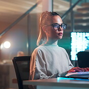 Programmer, typing and woman on computer at night and writing code and ...