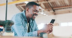 Phone, smile and man in workshop networking on social media, mobile app or the internet. Happy, technology and African male carpenter typing online email or message on cellphone in warehouse.