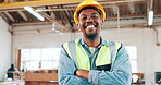 Face, engineer and happy black man with arms crossed in woodwork workshop. Portrait, smile and confidence of professional architect, contractor or worker in helmet at factory for carpentry in Nigeria