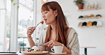 Happy woman, cafe and eating breakfast or waffles with customer service, enjoying meal and hospitality. Young person with fresh plate of pancakes or food for brunch at a restaurant or coffee shop
