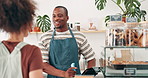 Cashier, customer service and order at counter with cafe questions, menu choice and hospitality in small business. Happy African barista, people or waiter working, talking and helping at coffee shop