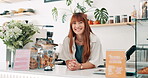 Face of woman, cafe business owner or cashier at counter for welcome, customer service and hospitality at startup. Portrait of young waitress, barista or seller at a bakery, restaurant or coffee shop