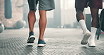 Men, gym and legs walking with bag for fitness, workout and exercise of a personal trainer and friends. Coach, wellness and ready for sport, boxing and fight routine with luggage at health club
