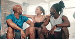 Fitness coach, group of people and gym for workout, training and teamwork with break, talking and planning together. Sports friends, woman and men in diversity and discussion of exercise or support