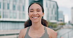 Woman, smile and portrait with buildings for fitness, training or health exercise in Europe. Female person, happy and face with sportswear outdoors for cardio, wellness or endurance workout in city