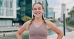 Fitness, smile and sports woman in city for marathon training, workout or cardio with pride. Portrait, exercise and running with happy, confident or satisfied young athlete outdoor in urban town