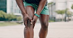 Closeup, person and runner in a city, knee pain and morning routine with sports accident and training mistake. Athlete, outdoor and exercise with fitness and emergency with ache and muscle tension