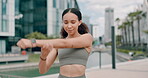 Slow motion video, woman and wearing activewear sports bra . Rose gold headphones , taking a break to restore breath . Viewing the exercise watch in the urban area in the middle of the city 