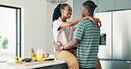 Black couple, kitchen and hug in a home with love, smile and bonding together with food. Happy, support and marriage with trust and relax from cooking with juice and fruit  in house at morning