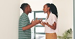Black couple, angry and fight in home with conflict for mistake, infidelity and disagreement in corridor. Divorce, man and woman with argument, communication or relationship problems and hand gesture