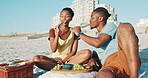 Picnic, alcohol and happy black couple on beach with champagne toast for anniversary, romance and date. Nature, love and people with drink, fruit and food on holiday, vacation and celebration by sea