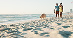 Travel, beach and couple walking with dog in nature for bonding, fun and freedom, playing or adventure. Energy, animal and African people with puppy Labrador at sea for vacation, games or fresh air