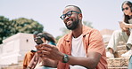 Black man, smartphone and happy student typing at university, social media and reading funny meme at steps. Phone, laughing and person in college for joke, scroll and mobile app at campus outdoor