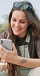 Smile, phone and woman in city networking on social media, mobile app or the internet. Happy, technology and young female person typing email, message or scroll online with cellphone in urban town.