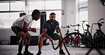 Man, personal trainer and battle rope at gym for workout, exercise or muscle endurance in fitness motivation. Serious, active male person or athlete with coach in stamina, cardio or intense training