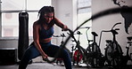 Black woman, fitness and battle rope at gym for workout, exercise or muscle endurance in health club. Indoor, active African female person or athlete in stamina, cardio or intense training for sweat