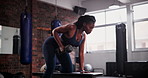 Black woman, dumbbell and weightlifting on bench at gym for exercise, strength or arm workout. African female person, athlete or bodybuilder in sports fitness, muscle gain or training at health club