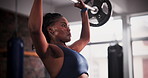 Weightlifting, fitness and black woman with muscle in gym for bodybuilder training, intense workout and exercise. Wellness, sports and person with barbell for challenge, strength and strong body