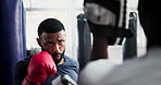 Men, boxing and coaching in gym for fitness, workout and training in MMA, fight and target support. Strong boxer, people or personal trainer helping with pads for sports, power or exercise challenge