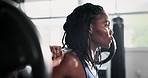 Lifting weights, fitness and black woman in gym for bodybuilder training, intense workout and exercise. Serious, sports and person with barbell equipment for wellness, strength and muscle challenge