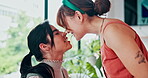 Nose, smile and cute with LGBT couple in living room of home together for love, romance or bonding. Profile, gay or lesbian and loving woman playing with sweet relationship partner in apartment