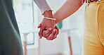 Couple, holding hands and together for care indoor, lesbian and bonding with touch in healthy relationship. People, trust or solidarity in union in commitment, support or symbol of love with kindness