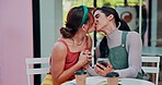Cafe, kiss and lesbian couple with phone, news or holding hands for exciting news, text or email outdoor. LGBTQ, love and women with smartphone alert for home loan, success or embracing with support 