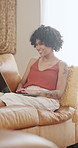 Happy, laptop and woman on sofa in home for online shopping, social networking and communication. Relax, smile and person typing on computer for internet, website and streaming videos in living room