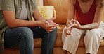 Woman, hands and lesbian couple in conflict on sofa for fight, argument or confession in living room at home. Closeup of female person, LGBTQ or gay people in disagreement, dispute or break up