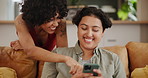 Love, phone or lesbian couple on sofa for internet, search or hand pointing to ecommerce deal at home. LGBTQ, smartphone or queer people in living room for online shopping, choice or sign up decision