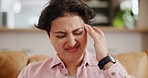 Frustrated woman, headache and stress in anxiety, depression or mistake on living room sofa at home. Female person with migraine in mental health, strain or pressure from debt or financial crisis