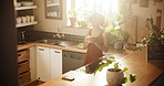 Woman, kitchen and drinking coffee in morning or relax for breakfast or thinking at home. Female person with mug or tea cup and enjoying beverage, latte or cappuccino by window for sunshine at house