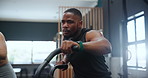 Fitness, spin class and black man in gym for training, intense workout and exercise for health. Sports, cardio machine and person on cycling equipment for performance, strong muscles and wellness