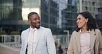 Walking, happy and business people in city in discussion, conversation and talking on morning commute. Corporate workers, teamwork and man and woman in urban town for journey, travel and networking