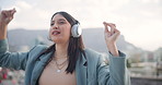 Woman, dance and headphones with music in city with inspiration, energy and streaming in Cape Town. Lady, walking and girl with headset outdoor, listening to radio and relax with audio in morning