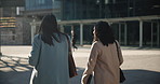 Walking, women and business people in city in discussion, conversation and talking on morning commute. Corporate office, teamwork and back of workers in urban town for journey, travel and networking