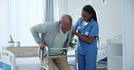 Senior man, walker and nurse support with caregiver, help and physical therapy assistance in clinic. Healthcare, hospital and nursing care with African patient with rehabilitation with walking